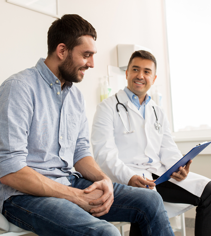 Photo of man speaking with his doctor