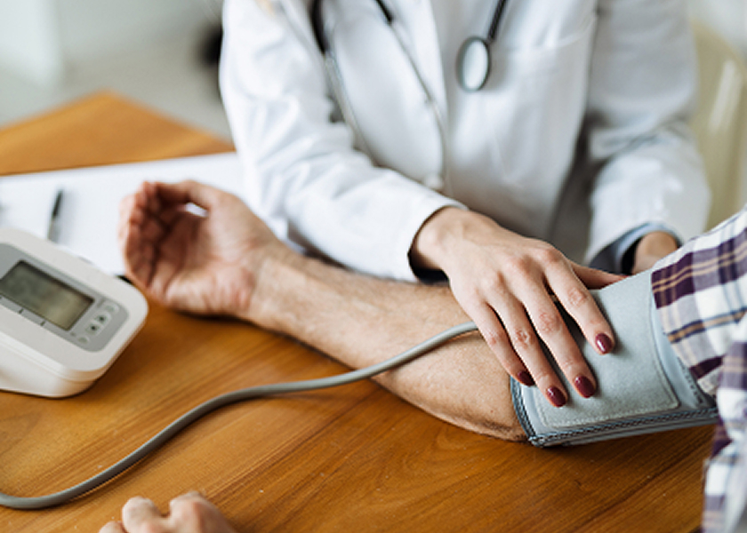 Photo of person having their blood pressure taken